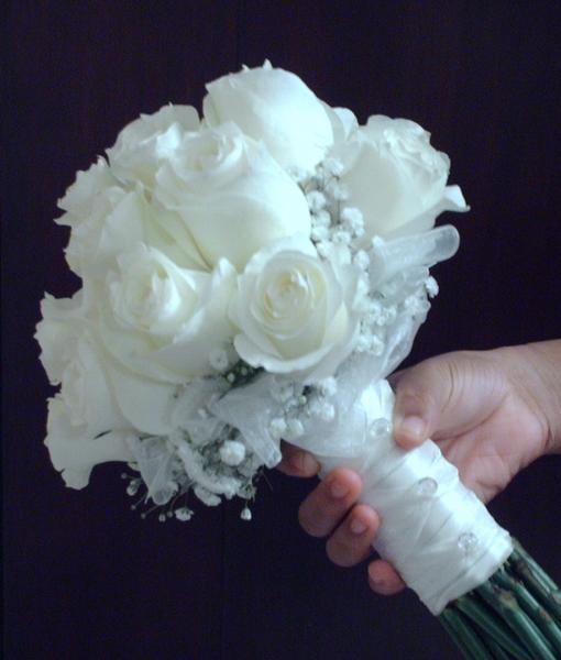 White roses,baby's breath, and white ribbon