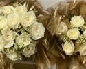 Simple white garden rose and white wax flower bouquets.