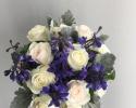 Bride or Bridesmaid Bouquet using dark blue delphinium, blush and ivory roses, accented with dusty miller.