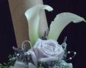 White calla lily's, lavender roses, filler, greenery, and ribbon