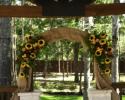 Burlap arch,accented with sunflowers, roses, and viking poms