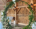 Beautiful suspended swing decorations. Greenery and white accent flowers give this elegant swing just a little pop for extra attention.