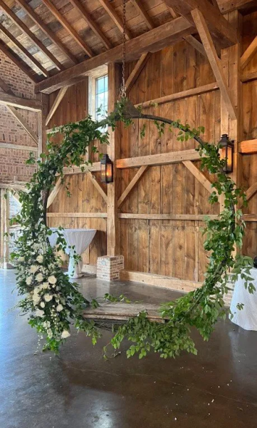 Beautiful suspended swing decorations. Greenery and white accent flowers give this elegant swing just a little pop for extra attention.