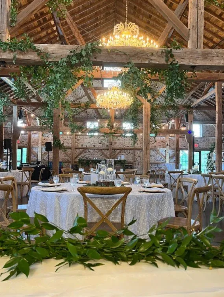 Need to add a little extra something to a rustic venue? Think greenery. Simple greenery decorations elevate any venue. 