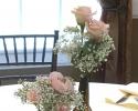Mason jar, beer bottle with twine, baby's breath and light pink roses