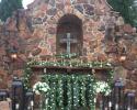 Outdoor Ceremony Flower by Exotica the signature of flowers- at Madera Estates
Green mixed garland accented with white flowers, crystals, and gold candle-stands and candles. 
Photography- Angela Nobles: Photographer