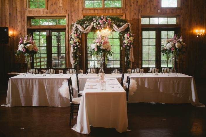 Head Table Display using light pink and creme roses